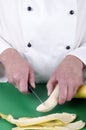 Female chef preparing a banana Royalty Free Stock Photo