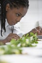 Female Chef Preparing Salad In Kitchen Royalty Free Stock Photo