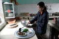 Female chef process fried cicadas