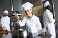 Female chef tasting dish by her Royalty Free Stock Photo