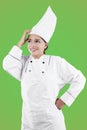 Female chef thinking something in the studio