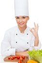 Female chef with vagetables showing ok sign Royalty Free Stock Photo