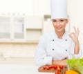 Female chef with vegetables showing ok sign Royalty Free Stock Photo
