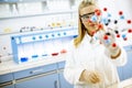 Female chemist hold molecular model in the lab Royalty Free Stock Photo