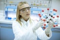 Female chemist hold molecular model in the lab Royalty Free Stock Photo