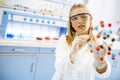 Female chemist hold molecular model in the lab Royalty Free Stock Photo