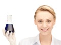 Female chemist holding bulb with chemicals Royalty Free Stock Photo
