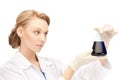 Female chemist holding bulb with chemicals Royalty Free Stock Photo