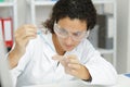 female chemist holding flask Royalty Free Stock Photo