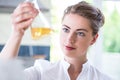 Female chemist holding flask Royalty Free Stock Photo