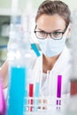 Female chemist in mask Royalty Free Stock Photo