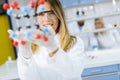 Female chemist hold molecular model in the lab Royalty Free Stock Photo