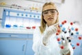 Female chemist hold molecular model in the lab Royalty Free Stock Photo