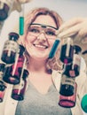 Female chemistry student with glassware test flask. Royalty Free Stock Photo