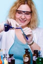 Female chemistry student with glassware test flask. Royalty Free Stock Photo