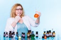 Female chemistry student with glassware test flask. Royalty Free Stock Photo