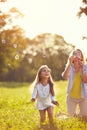 Female child chase soap bubbles Royalty Free Stock Photo