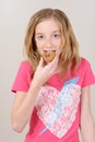 Female child eating chocolate cookie