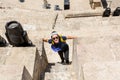 A female Chinese tourist in the ancient roman amphitheatre in Amman, Jordan