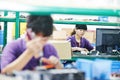 Female chinese worker in factory Royalty Free Stock Photo