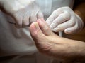 Female chiropodist working on a senior clients feet Royalty Free Stock Photo