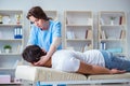 The female chiropractor doctor massaging male patient Royalty Free Stock Photo