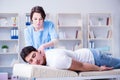 The female chiropractor doctor massaging male patient Royalty Free Stock Photo