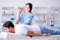 The female chiropractor doctor massaging male patient Royalty Free Stock Photo