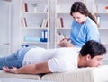 Female chiropractor doctor massaging male patient Royalty Free Stock Photo