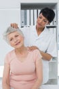 Female chiropractor doing neck adjustment Royalty Free Stock Photo