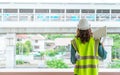 Female Civil engineer working on tranportation development in the background Royalty Free Stock Photo