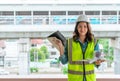 Female engineer working on transportation development in the background Royalty Free Stock Photo