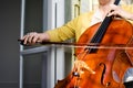 Female classical musician playing cello