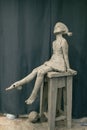 Female clay human woman sculpture. Statue craft creation workshop