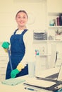 Female cleaner with duster Royalty Free Stock Photo