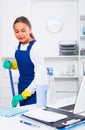 Female cleaner with duster Royalty Free Stock Photo