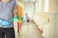 Female cleaning staff in bathroom blurry background Metaphor for