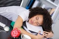 female clerical worker asleep at desk