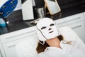 Female client getting face skin phototherapy procedure Royalty Free Stock Photo