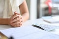 Female client meeting with her personal lawyer, clasped her hands clenched together on table Royalty Free Stock Photo