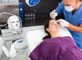 Female client during procedure of face mesotherapy in aesthetic cosmetology clinic Royalty Free Stock Photo