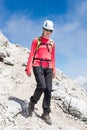 Female climber descending a mountain trail