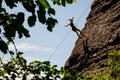 Female climber falling down off the cliff Royalty Free Stock Photo