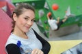 Female climber posing at indoor climbing wall Royalty Free Stock Photo