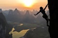 Female climber silhouette in Chinese landscape Royalty Free Stock Photo