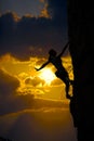 Female climber silhouette and sunset cloud sky Royalty Free Stock Photo