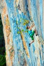 Female Climber Trying to keep Hold in last Effort to avoid deep fall down Royalty Free Stock Photo