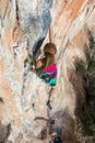 Female Climber Trying to keep Hold in last Effort to avoid deep fall down