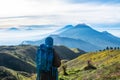 Female climbers carry backpacks and see the mountain scenery