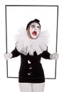 A female clown in a frame is crying Royalty Free Stock Photo